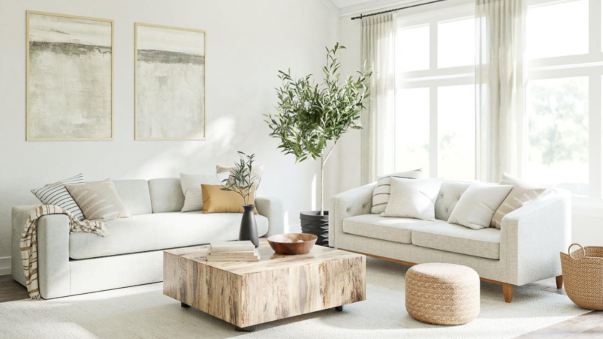 A harmonious living room designed with feng shui principles, featuring neutral earth tones and a large plant to create a calm and balanced chi energy flow.