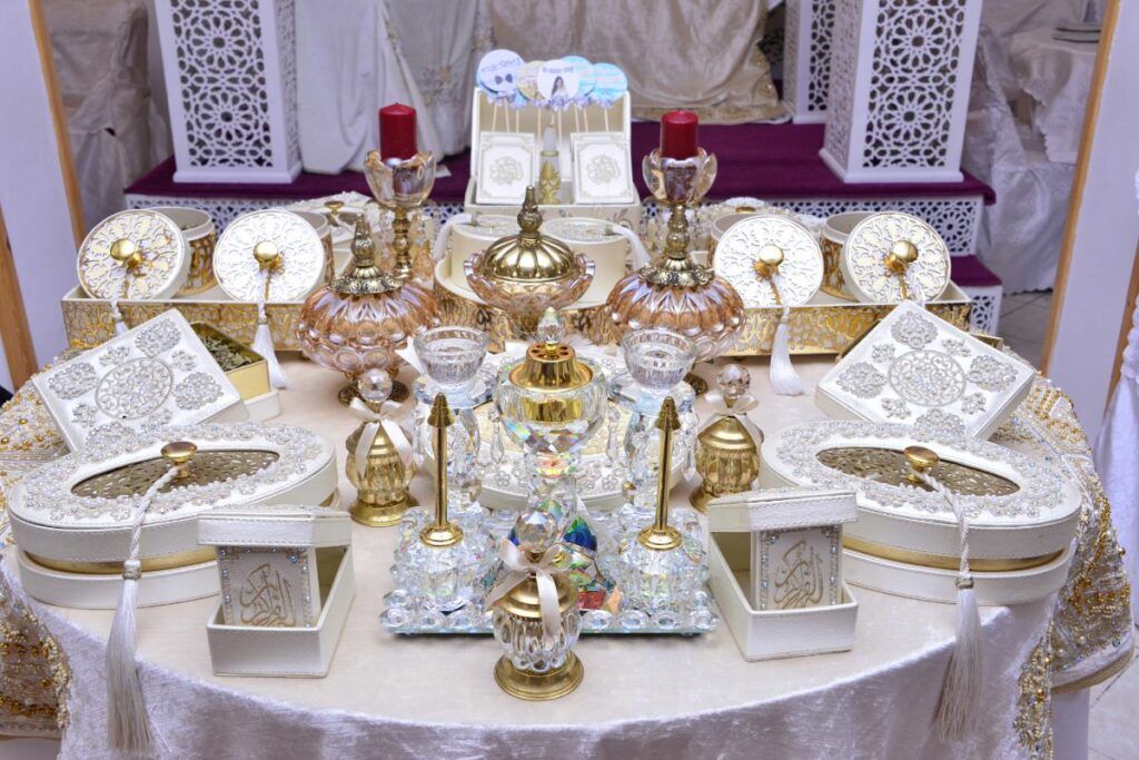 An elaborate gift table at a Moroccan or Muslim wedding, featuring ornate glassware and decorative items for the new couple's home.