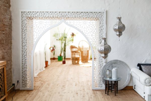 A detailed close-up of a wooden Mashrabiya wooden elements at Morrocan home, showing its intricate geometric latticework.